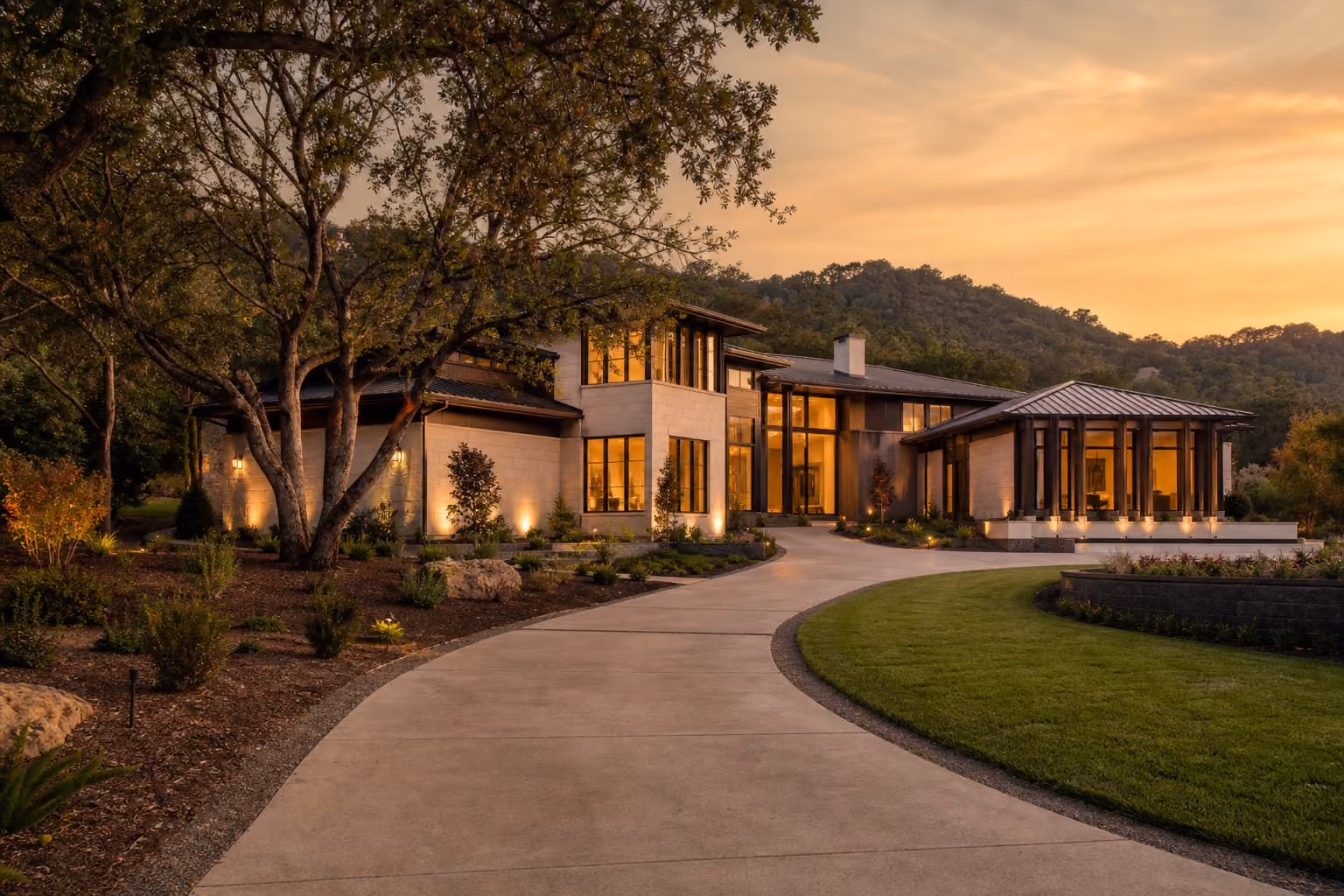 Luxury Danville home exterior at golden hour with mature oaks